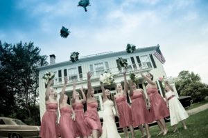 bridesmaids throwing bouquets