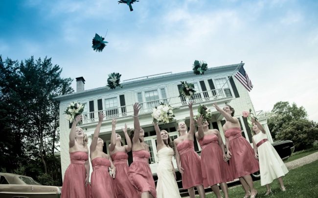 bridesmaids throwing bouquets